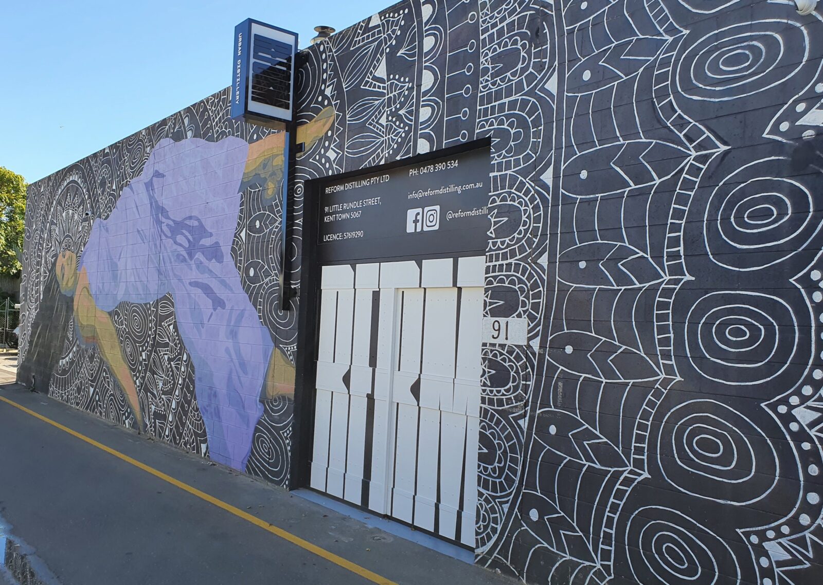 External view of Reform Distilling including the street art on the building frontage