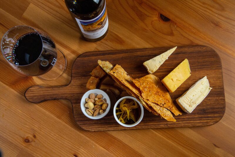 Cheese and crackers board with a glass of red wine at Reillys Wines Cellar Door, Mintaro SA