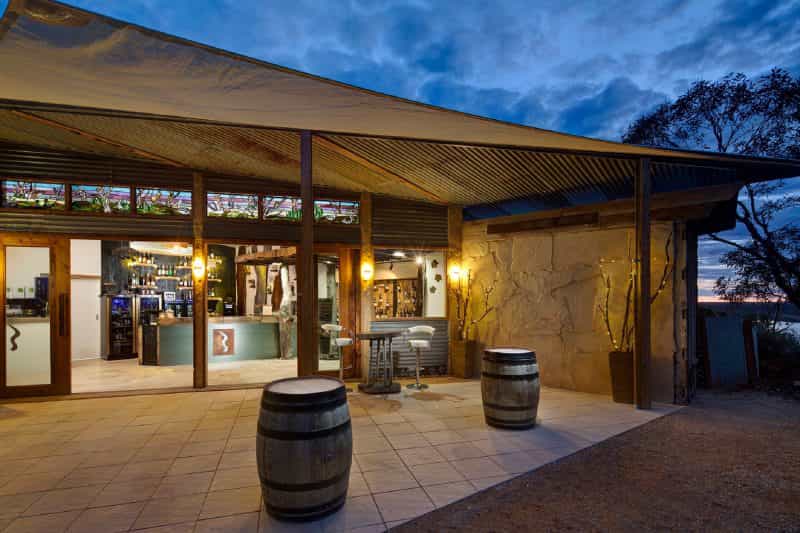 Exterior alfresco area at night of the Riverland Wine Centre
