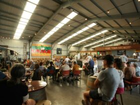 View of the Robe Town Brewery cellar door with people sitting at the tables
