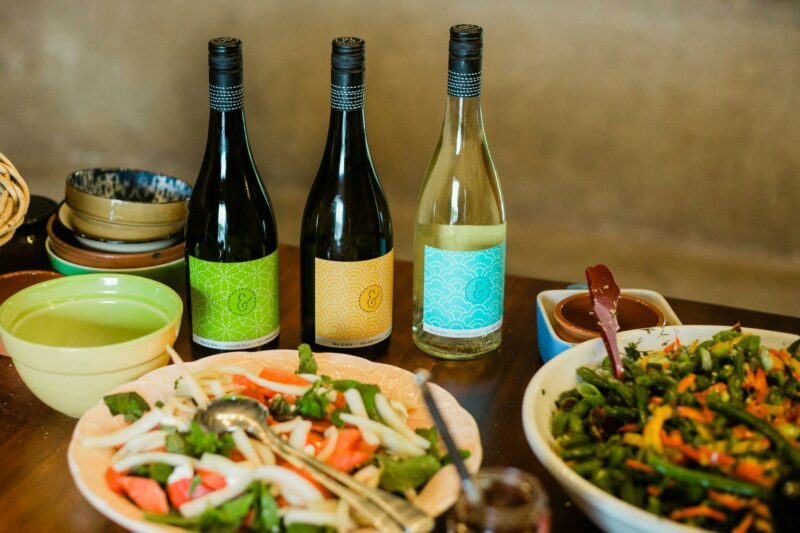 Inside the cellar door looking at a table filled with delicious salads and bottles of Sew & Sew wine