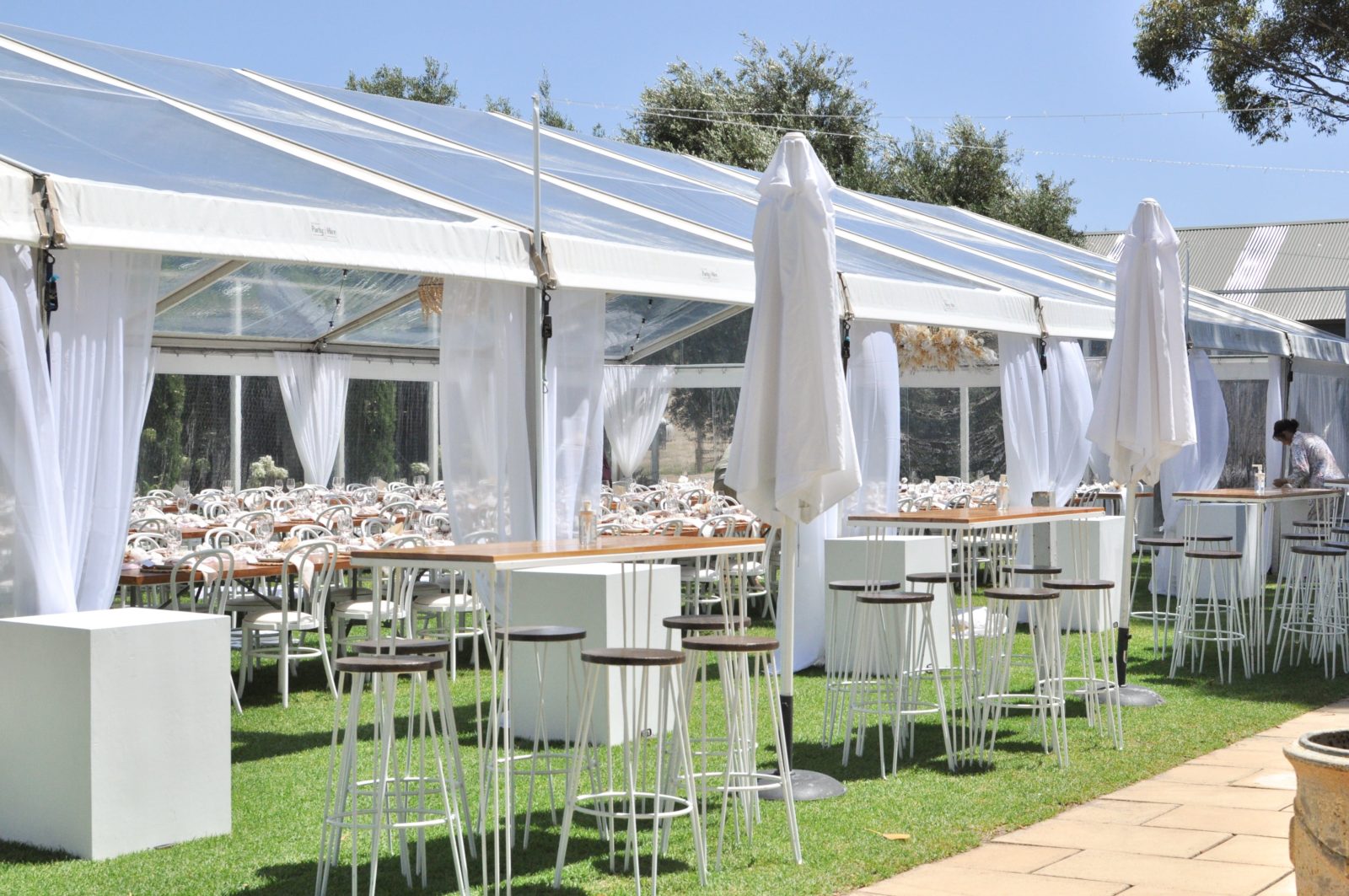 Clear pavilion with festoon lighting, boho shades and drapes