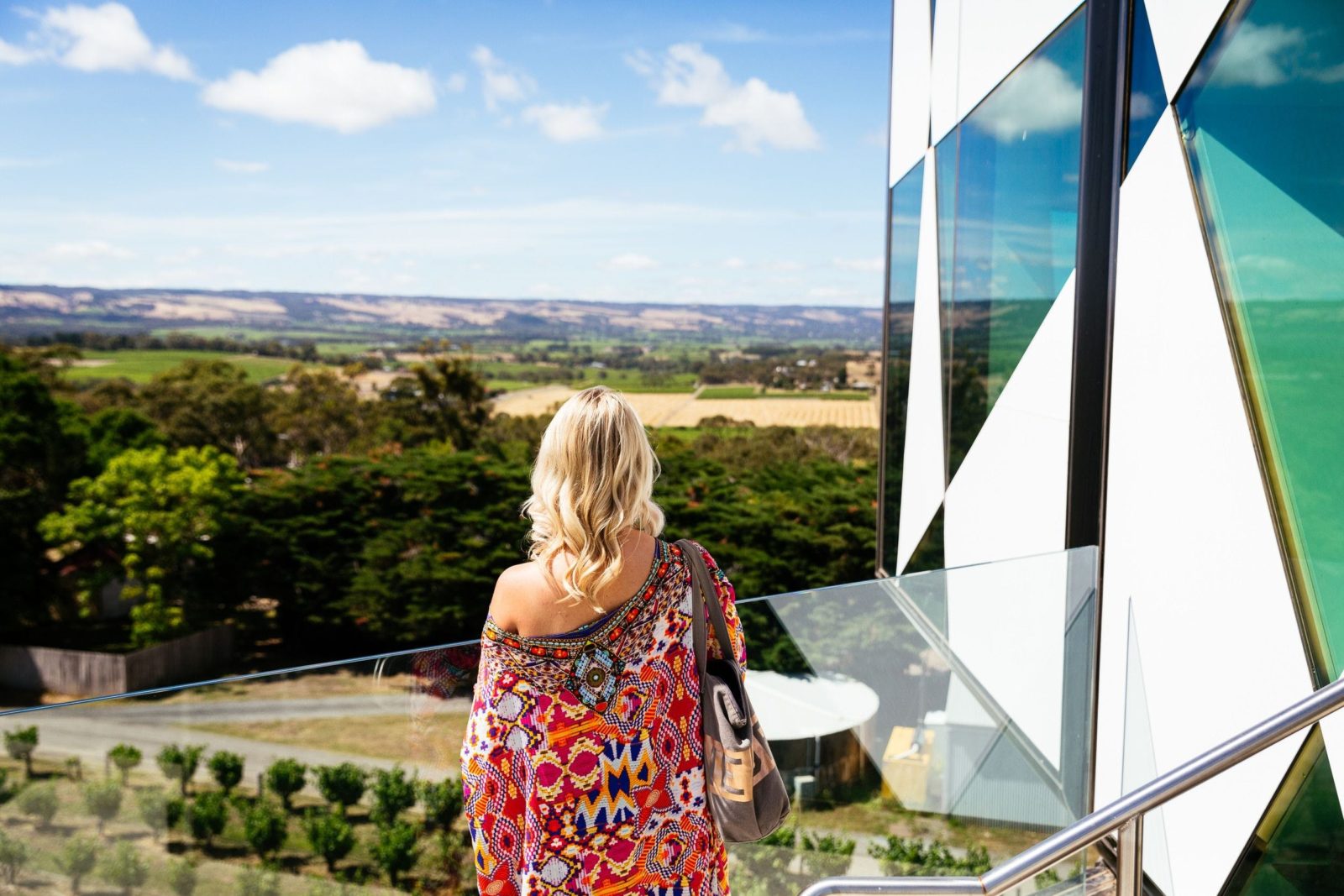 Lady looking out over the hills from balcony of d'Arenberg Cube