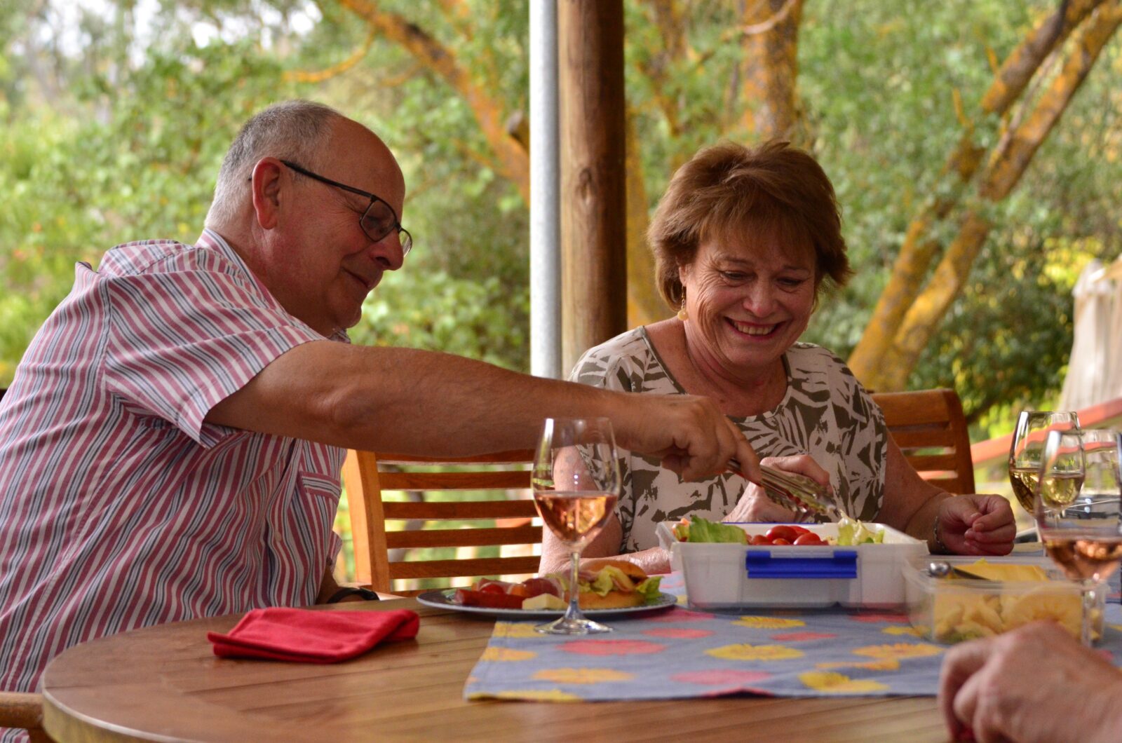 A couple enjoying gourmet picnic on their Clare Valley Food and Wine Tour