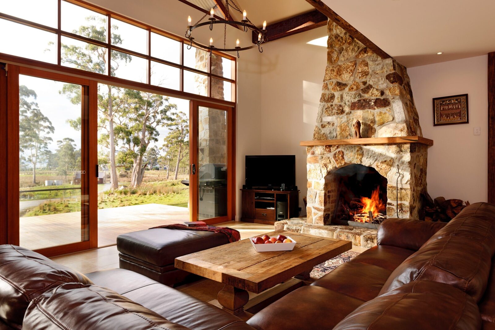 Deep leather lounges, wood fire and magnificent views across the property