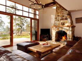 Deep leather lounges, wood fire and magnificent views across the property