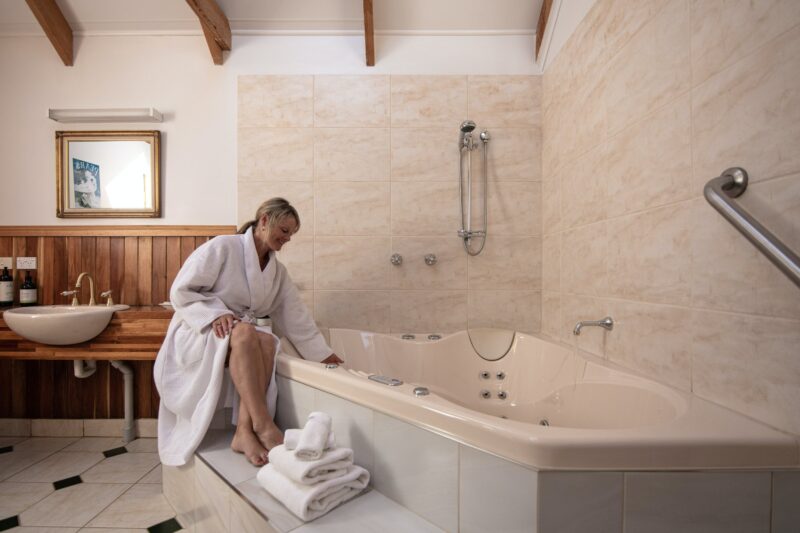Ellie's Spa Cottage features a 2 person hydrotherapy massage spa with towels, bathrobes, toiletries.
