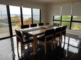 Large Dining table. Able to seat 8 people. Ecellent views of the ocean