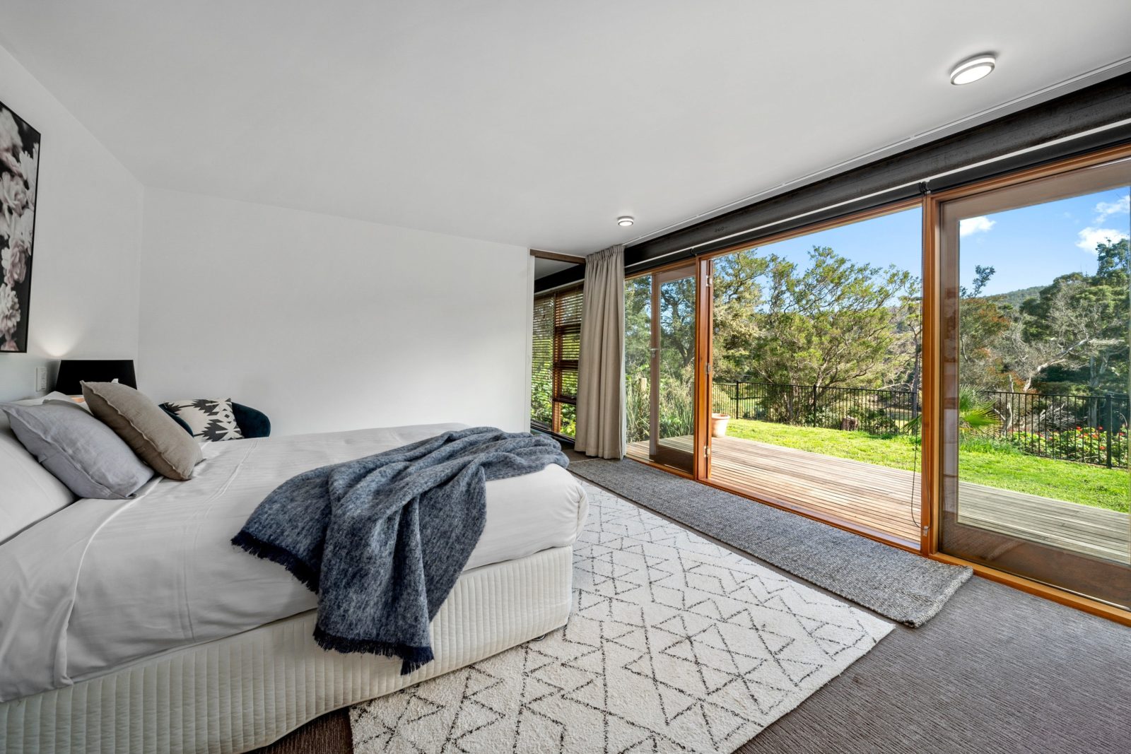 Master bedroom has an adjoining deck overlooking the river.