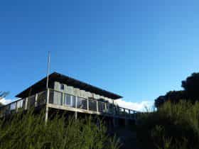 The bush retreat is nestled in a secluded teatree forest with sweeping ocean views.