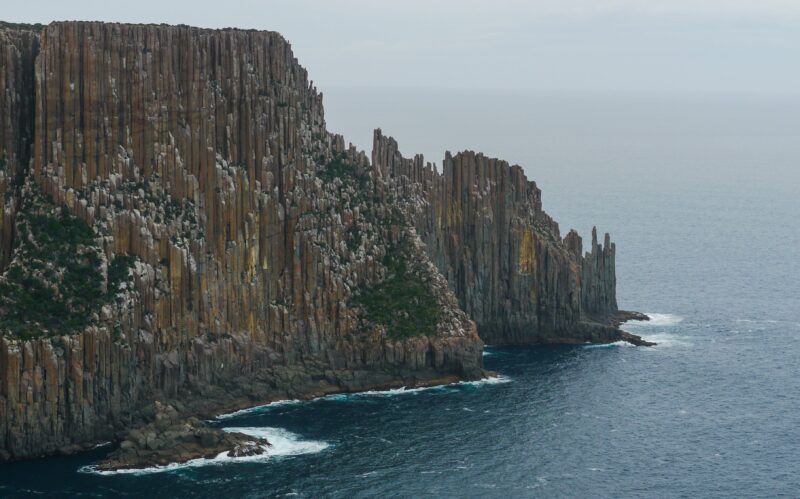 The dramatic dolerite column cliffs along Cape Raoul