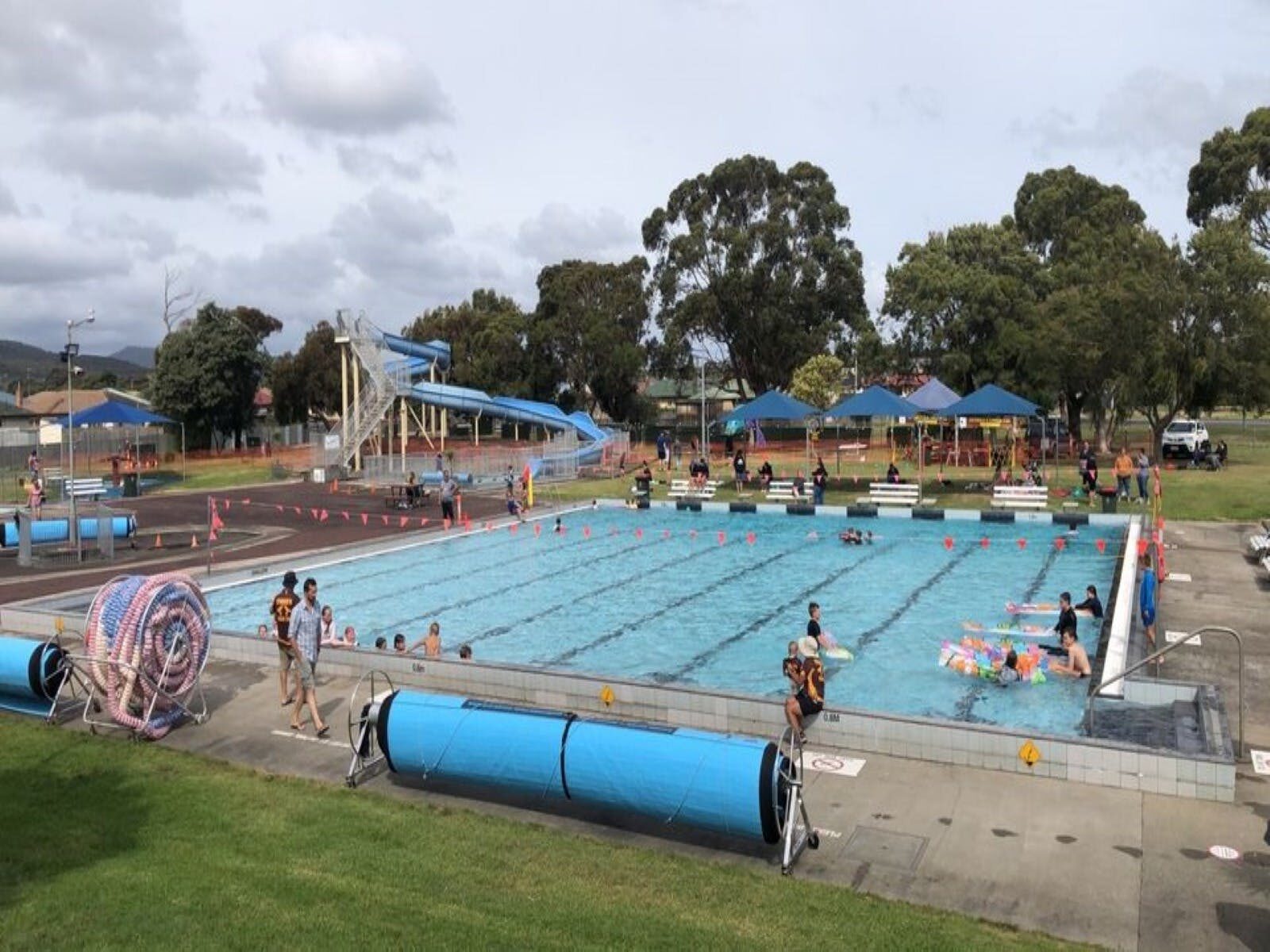 Photo of pool and people swimming