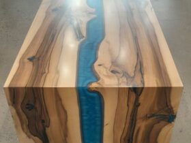 Picture of a coffee table with dark and light stripes and a blue river in the middle