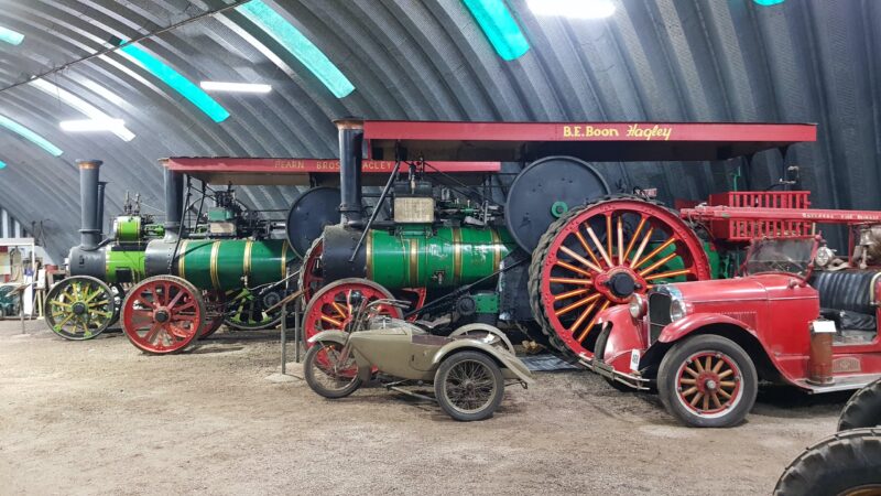 Two large steam Traction Engines, a vintage motor bike, and town Fire Engine, all from the 1920's.