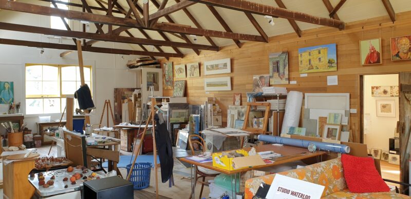 inside the historic apple packing shed showing the messy working area of Studio Waterlood