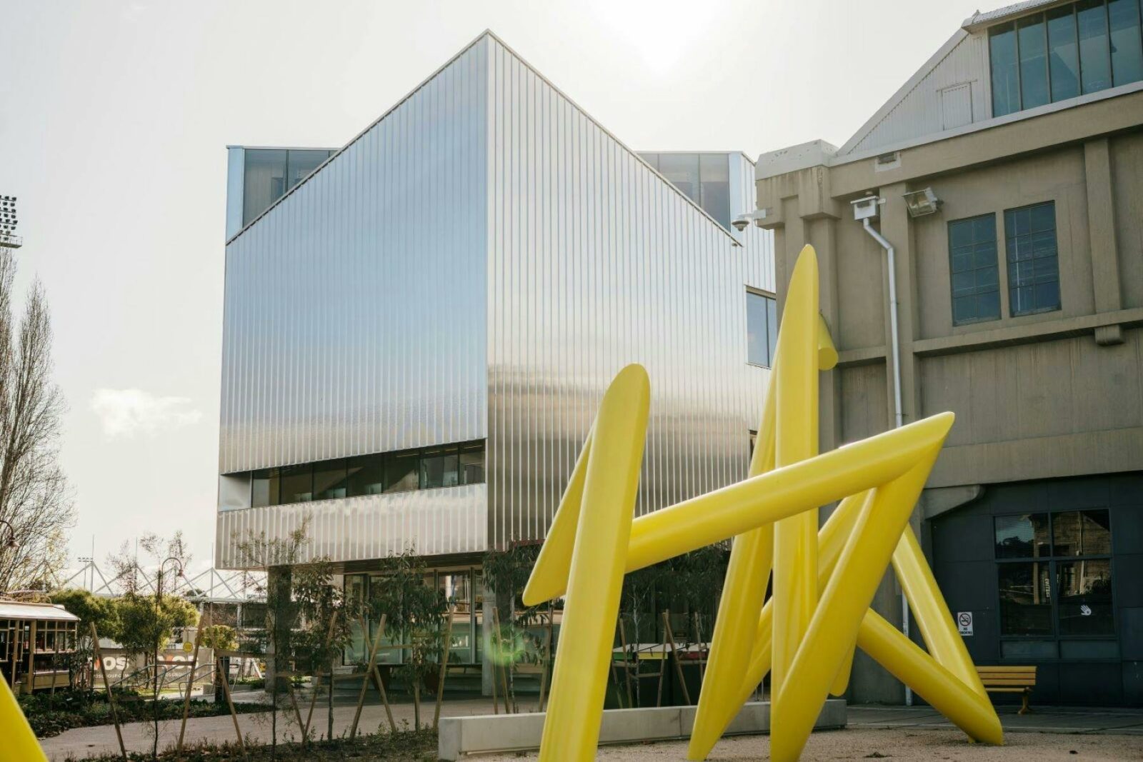 UTAS inversek campus building with Yellow triangular sculpture