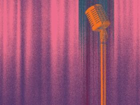old style microphone in front of a red curtain