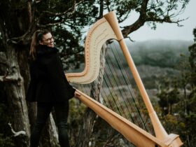 Emily pictured with a harp
