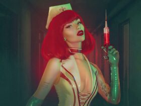 sexy red headed nurse brandishing syringe in dark hallway