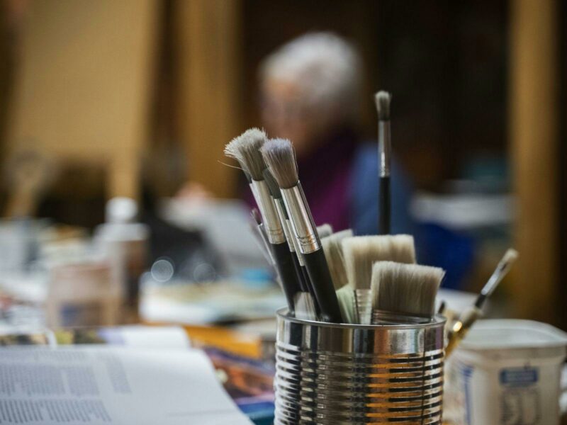 An inside image of the art studio where artists will spend the afternoon painting.