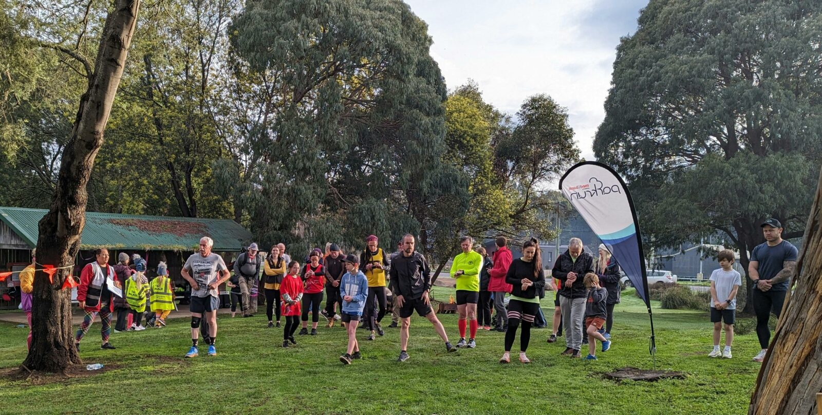 Runners and walkers crossing the starting line at Geeveston parkrun