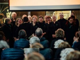 A group of choral singers performing for an audience