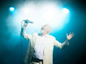 A photograph of Rod Anderson singing.