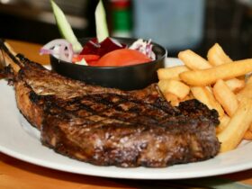 Tomahawk steak with chips and salad