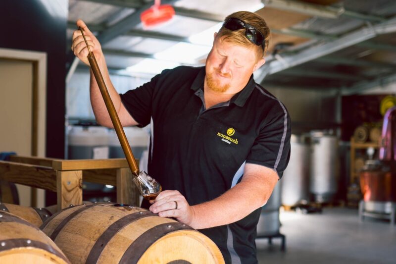 Our distiller taking a sample from the cask
