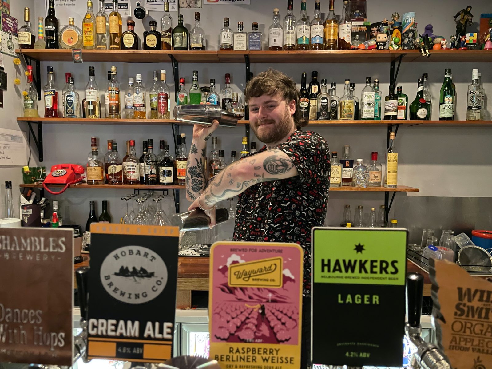 Bartender in bar shaking cocktails