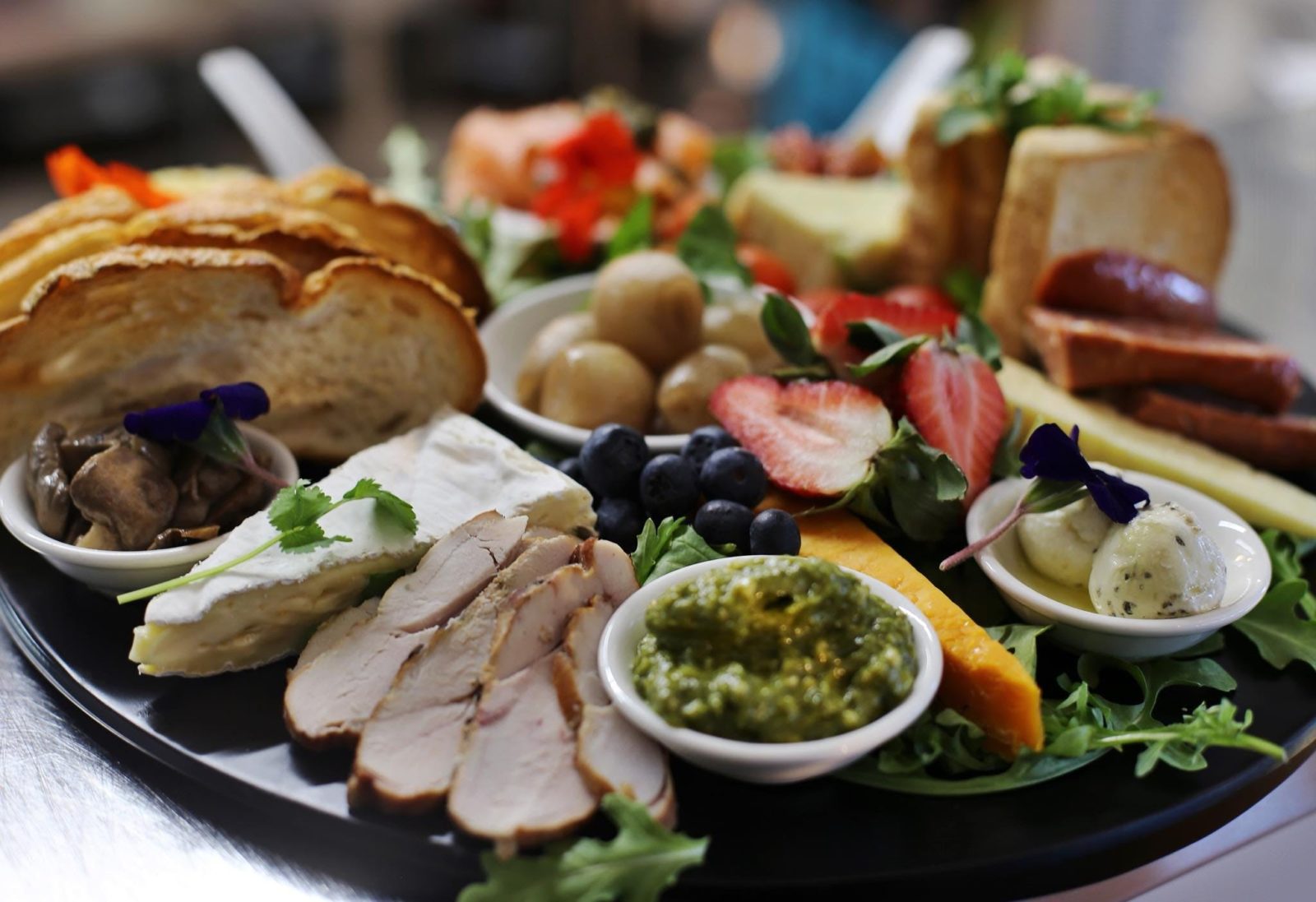 platter of fresh local cheeses, charcuterie, seafoods, fruits and our Tassie pickled onions.