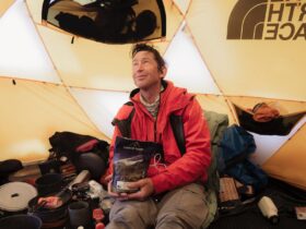 Tim Macartney-Snape enjoying a Campers Pantry meal in the mountains on location wth The North Face