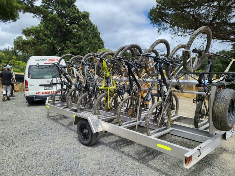 Shuttle bus and mountain trailer with mountain bikes