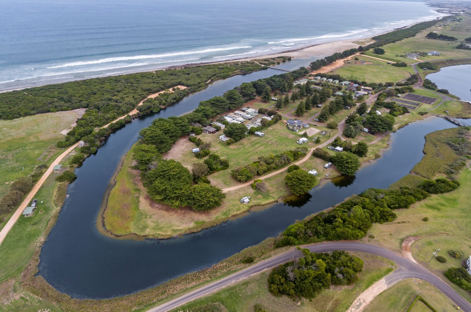 Aerial Shot of BIG4 Narrawong Island Holiday Park, Surrounded by Surry River and Beach