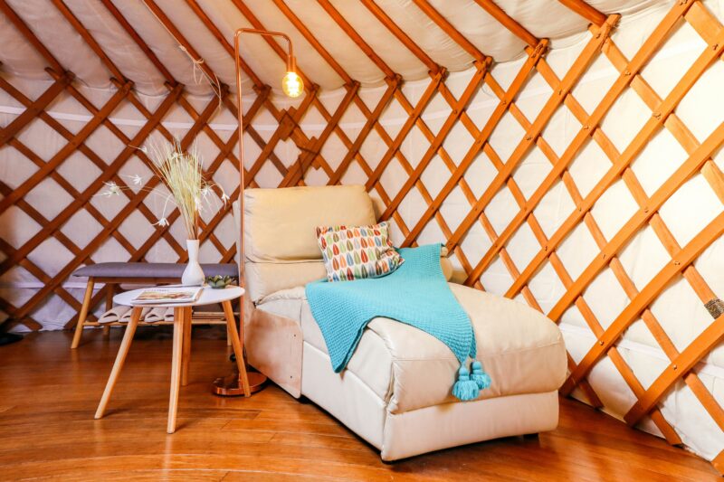 Day bed with side table inside yurt