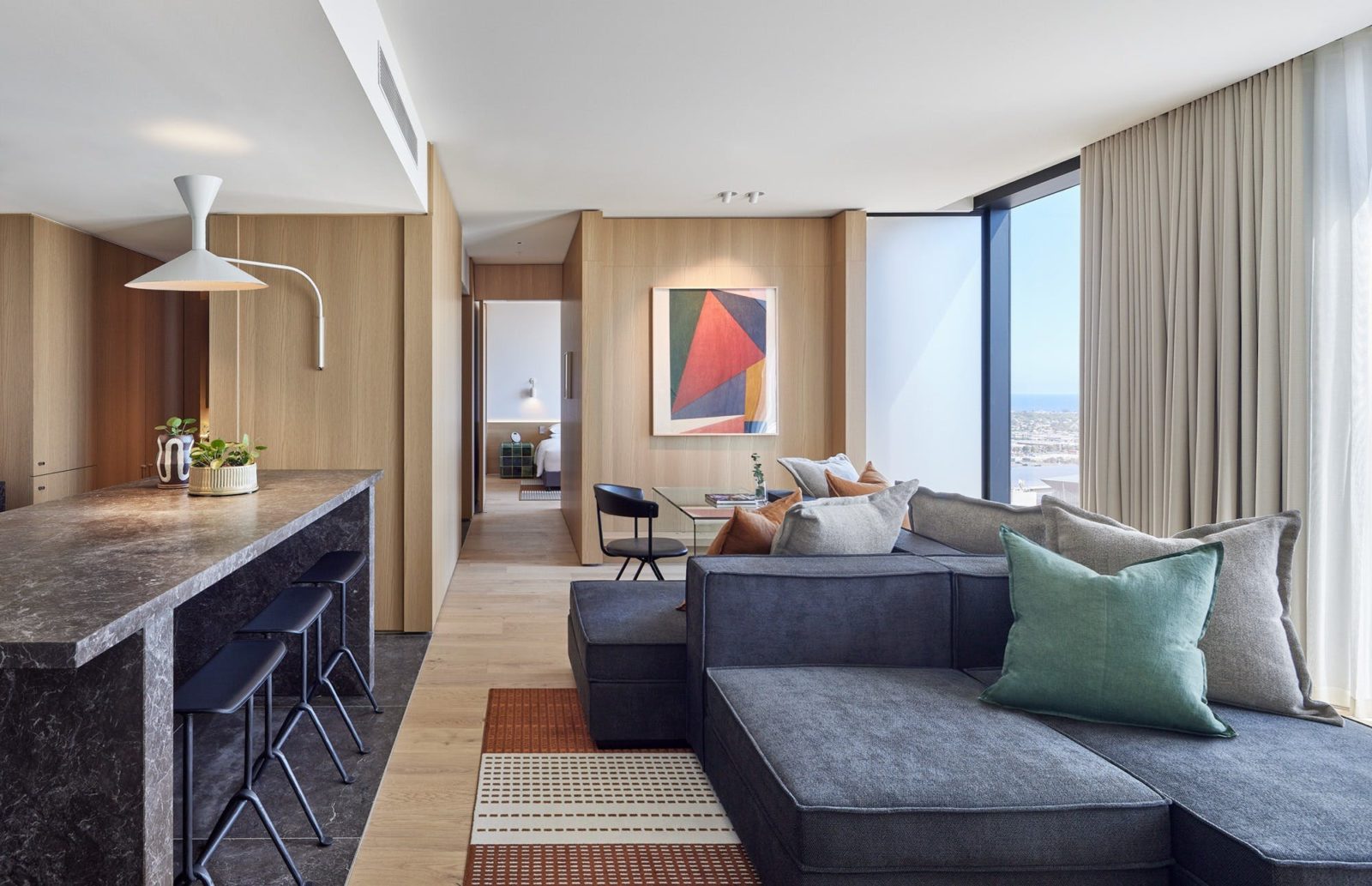 Premiere Suite showing modern styled living room looking towards bedroom