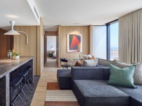 Premiere Suite showing modern styled living room looking towards bedroom