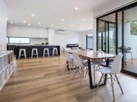 Large modern open space, timber floors, table with seating for 6 kitchen with island bench. well-lit
