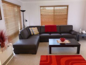 Relax in the Main Lounge room, large comfortable chaise lounge with TV/DVD and reading lamp
