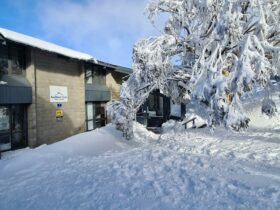 The Lodge entrance covered in snow