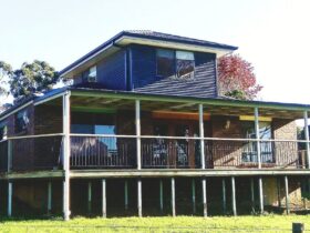Rear view of the property with a large deck