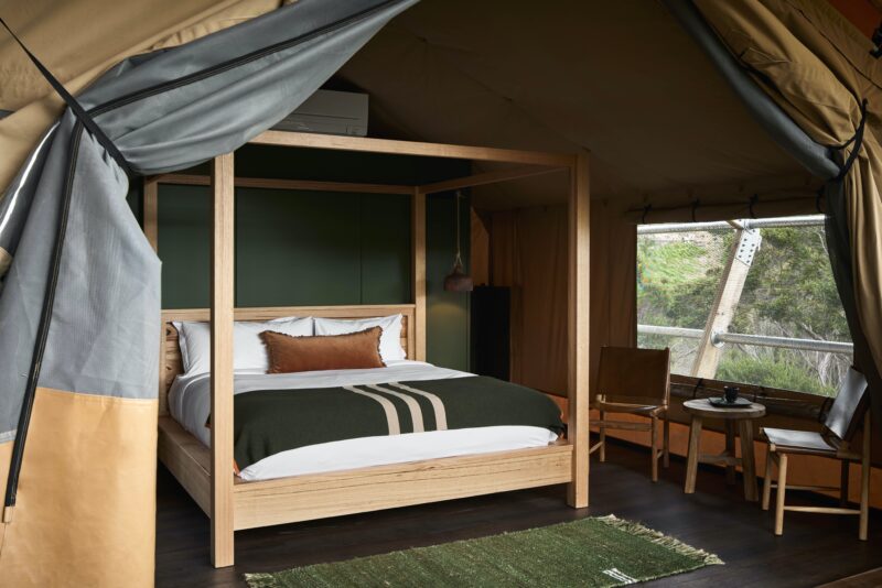 Each luxurious safari-style glamping tent features a premium king-size four poster bed.