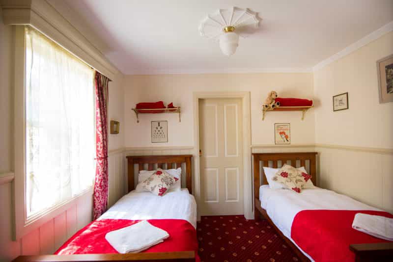 Second bedroom with two single beds.
