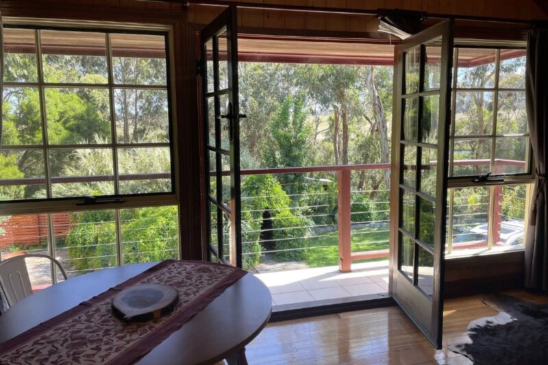 French doors leading to a small balcony from the dining area