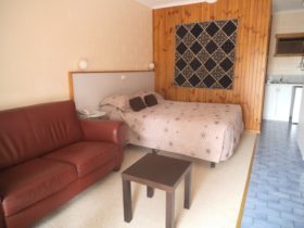 Queen Size bed, kitchenette, couch, tv