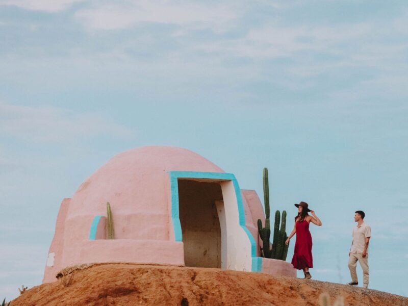 Exploring a beautiful pink dome in a cactus desert landscape