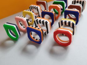 Rows of brightly coloured stripy rings - Clac Clac Design