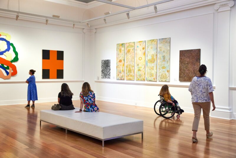 guests looking at artwork on walls of Geelong Gallery
