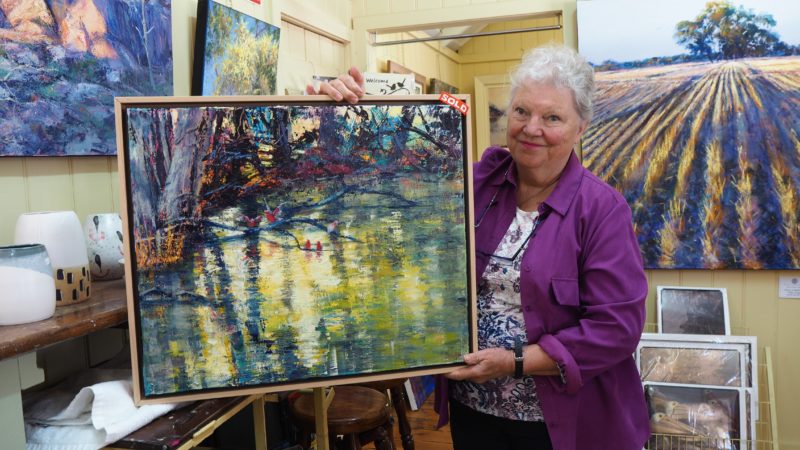 Glenda Cornell displaying her Art work