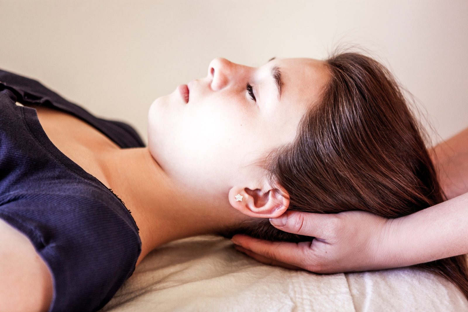 young woman receiveing a Reiki Treatment